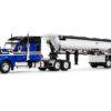 Kenworth W990 76″ Mid-Roof Sleeper and MAC Half Round End Dump Trailer Blue and Black 1/64 Diecast Model by DCP/First Gear